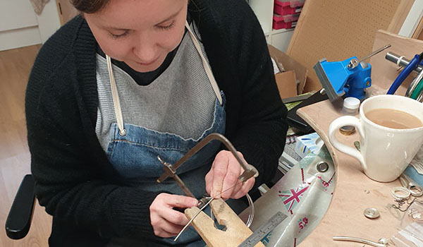 Amy Surman working with silver